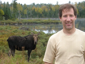 moose at lake with carl in foreground